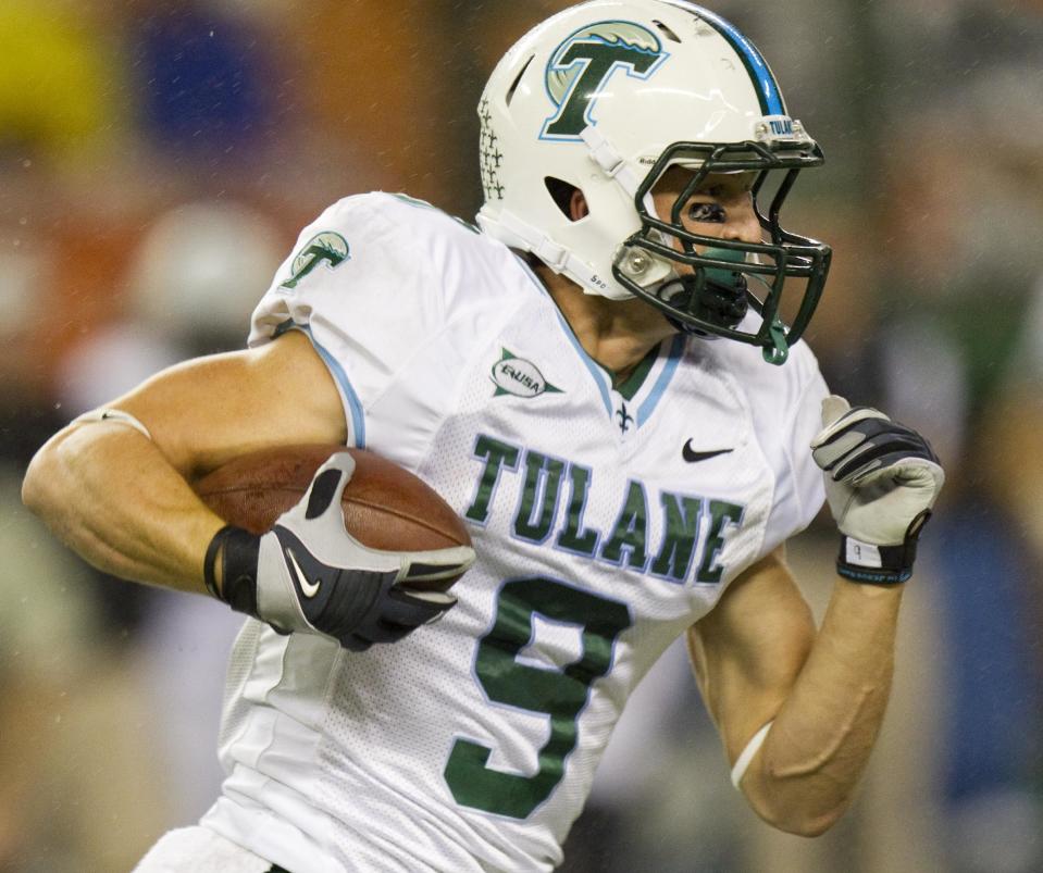 FILE - This Nov. 26, 2011 file photo shows Tulane wide receiver Wilson Van Hooser (9) taking off running in the third quarter of an NCAA college football game in Honolulu. A person familiar with the decision tells The Associated Press that Tulane University is joining the Big East as a full member in 2014 and East Carolina will be joining as a football-only member. The person spoke to the AP on condition of anonymity because neither the conference nor school was prepared to make an official announcement.(AP Photo/Eugene Tanner, File)