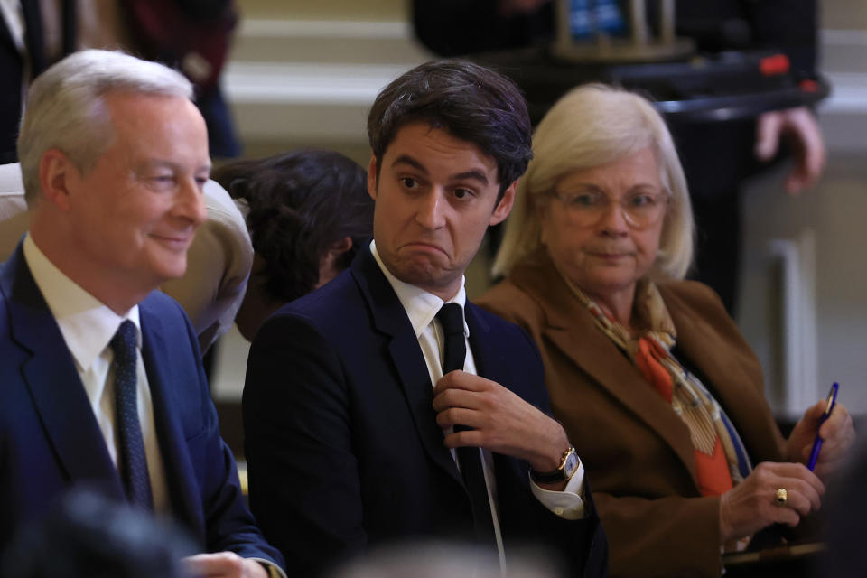 French Finance Minister Bruno Le Maire, left, French Prime Minister Gabriel Attal and French Minister for Labour, Health and Solidarities Catherine Vautrin attend French President Emmanuel Macron's news conference to announce his top priorities for the year as he seeks to revitalize his presidency, vowing to focus on "results" despite not having a majority in parliament, Tuesday, Jan. 16, 2024 at the Elysee Palace in Paris. (AP Photo/Aurelien Morissard)