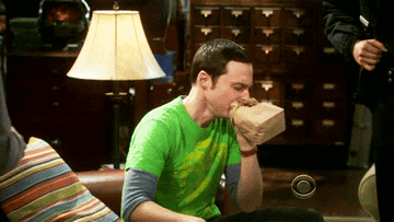 sheldon in big bang theory breathing into paper bag, panic attack