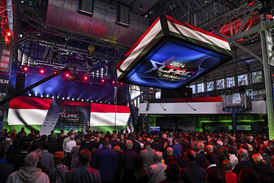 Participants sing the national anthem during the opening ceremony for the third Hungarian edition of the Conservative Political Action Conference (CPAC) in Budapest, Hungary, Thursday, April 25, 2024. The two-day event is hosted from April 25 to 26 by the Center for Fundamental Rights of Hungary for the third consecutive year. (Szilard Koszticsak/MTI via AP)