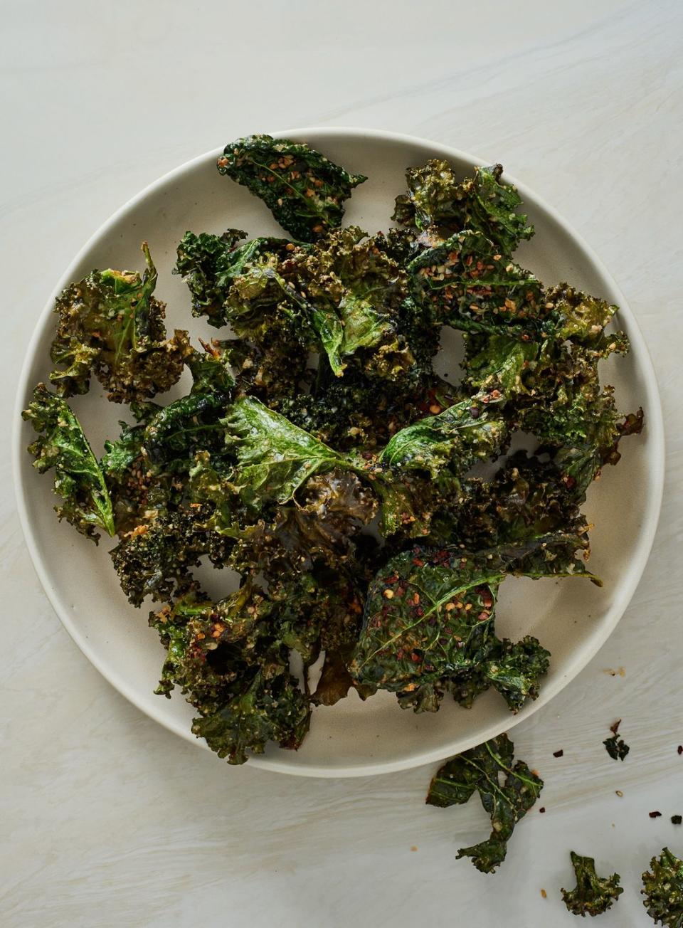 <p>These air fryer kale chips are a super tasty way to start a healthy chip habit (kale has 215% more fiber than potatoes!). They take just minutes to prepare, and using your <a href="https://www.delish.com/cooking/g4711/air-fryer-recipes/" rel="nofollow noopener" target="_blank" data-ylk="slk:air fryer;elm:context_link;itc:0;sec:content-canvas" class="link ">air fryer</a> means less grease <em>and</em> guilt. Feel free to customize your chips with different herbs and spices—the possibilities really are endless.<br><br>Get the <strong><a href="https://www.delish.com/cooking/recipe-ideas/a38760234/air-fryer-kale-chips-recipe/" rel="nofollow noopener" target="_blank" data-ylk="slk:Air Fryer Kale Chips recipe;elm:context_link;itc:0;sec:content-canvas" class="link ">Air Fryer Kale Chips recipe</a></strong>.</p>