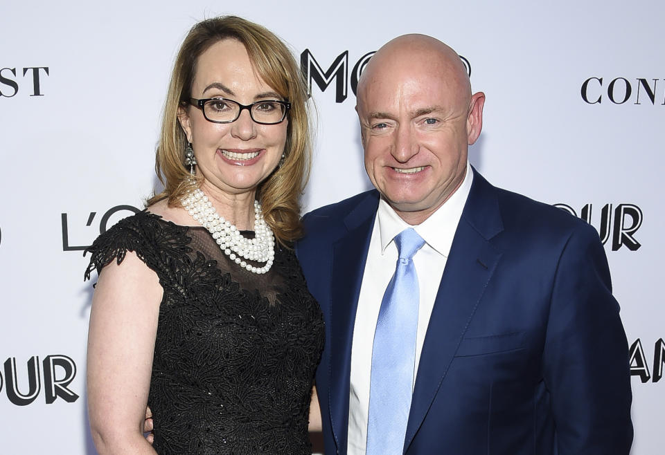 FILE- In this Nov. 12, 2018, file photo politician and gun control advocate Gabrielle Giffords and husband, retired astronaut Mark Kelly, attend the Glamour Women of the Year Awards at Spring Studios in New York. Kelly is kicking off his U.S. Senate campaign Saturday, Feb. 23, 2019 with a rally in Tucson. (Photo by Evan Agostini/Invision/AP, File)