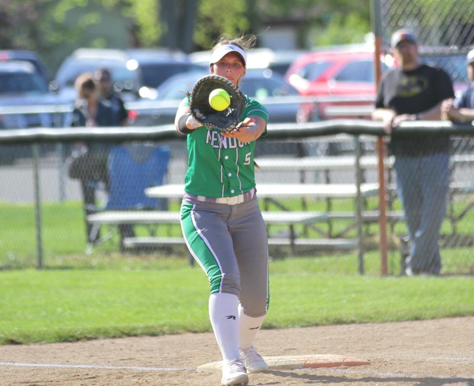 Cienna Nightingale catches a ball for an out at first base for Mendon on Wednesday.
