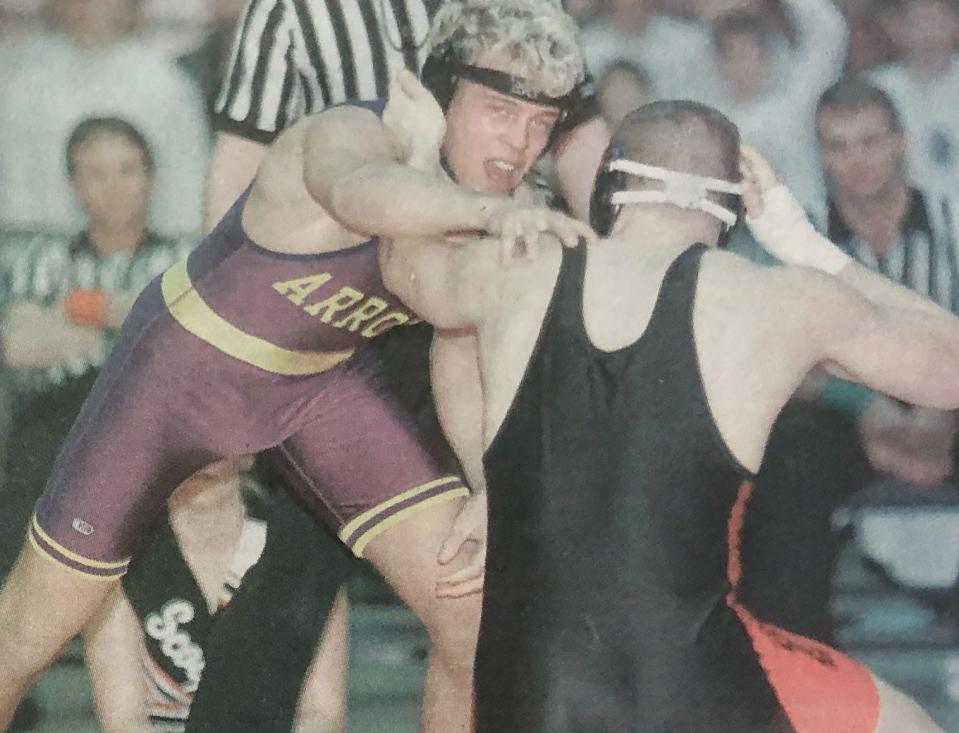 Watertown's Justin Ward battles with Sturgis' Lyle Long during their 145-pound championship in the 1999 state Class A wrestling tournament at Sioux Falls. Ward won three-straight state titles from 1998-2000.