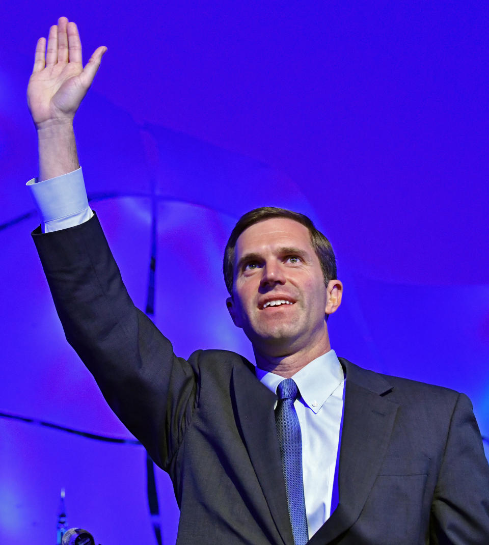 Kentucky Attorney General Andy Beshear waves to his supporters following his victory in the Democratic primary for governor in Louisville, Ky., Tuesday, May 21, 2019.