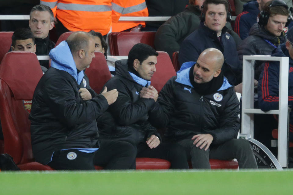 Mikel Arteta and Pep Guardiola during the Premier League match between Arsenal FC and Manchester City. (Credit: Getty Images)