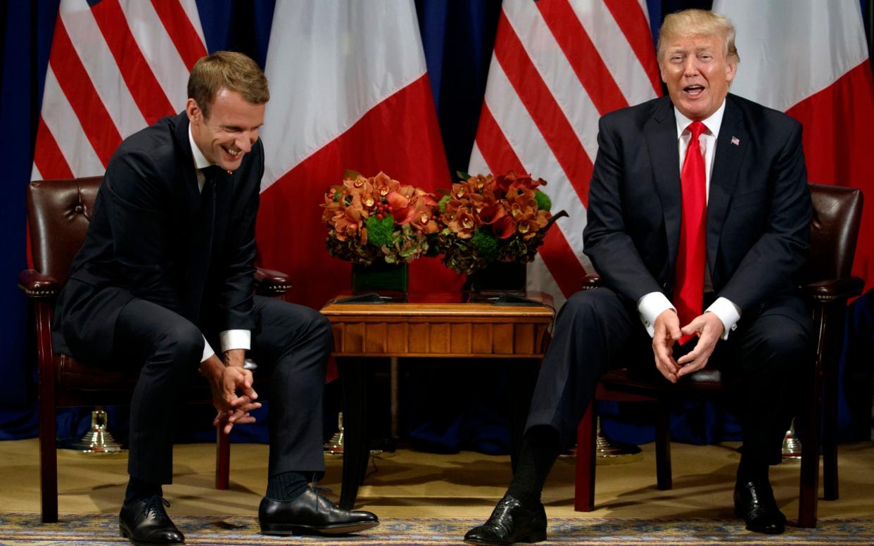 President Donald Trump jokes with French President Emmanuel Macron during a meeting at the Palace Hotel during the United Nations General Assembly - AP