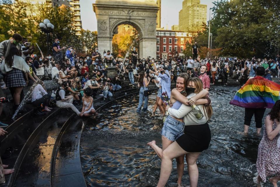 <div class="inline-image__caption"><p>People stood in the fountain as they celebrated in Washington Square Park after it was announced that Democratic nominee Joe Biden would be the next U.S. President on November 7, 2020 in New York City.</p></div> <div class="inline-image__credit">Stephanie Keith/Getty</div>