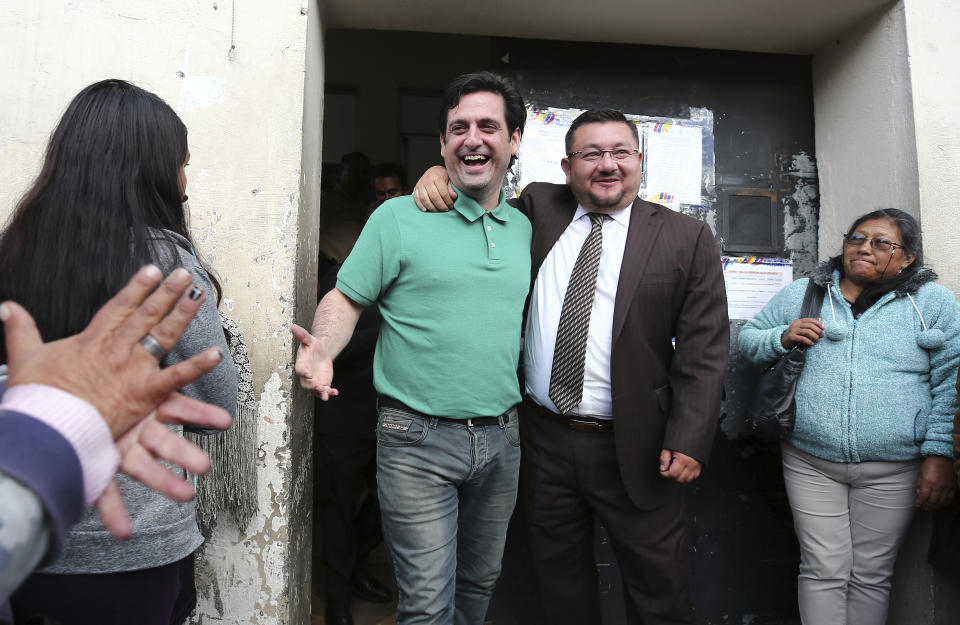 U.S. citizen Paul Ceglia, center left, leaves jail accompanied by his lawyer Norman Perez in Quito, Ecuador, Tuesday, June 11, 2019. Ecuador released the New York man and turned down an extradition request from the United States, where he was arrested after falsely claiming he was owed half-ownership of Facebook. (AP Photo/Soledad Nunez)