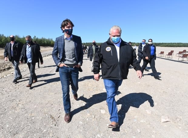 Prime Minister Justin Trudeau, left, talks with Ontario Premier Doug Ford after taking part in a groundbreaking event at the Iamgold Cote Gold mining site in Gogama, Ont., on Friday, September 11, 2020.