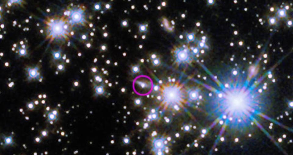 The Hubble Space Telescope’s Wide Field Camera 3 revealed the infrared afterglow (circled) of the BOAT GRB and its host galaxy, seen nearly edge-on as a sliver of light extending to the burst's upper right. This composite incorporates images taken on Nov. 8 and Dec. 4, 2022, one and two months after the eruption.