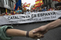 <p>Anti-independence demonstrators march in protest against the independence referendum on Sept.30, 2017 in Barcelona, Spain. The Catalan government is keeping with its plan to hold a referendum, due to take place on Oct. 1, which has been deemed illegal by the Spanish government in Madrid. (Photo: Dan Kitwood/Getty Images) </p>