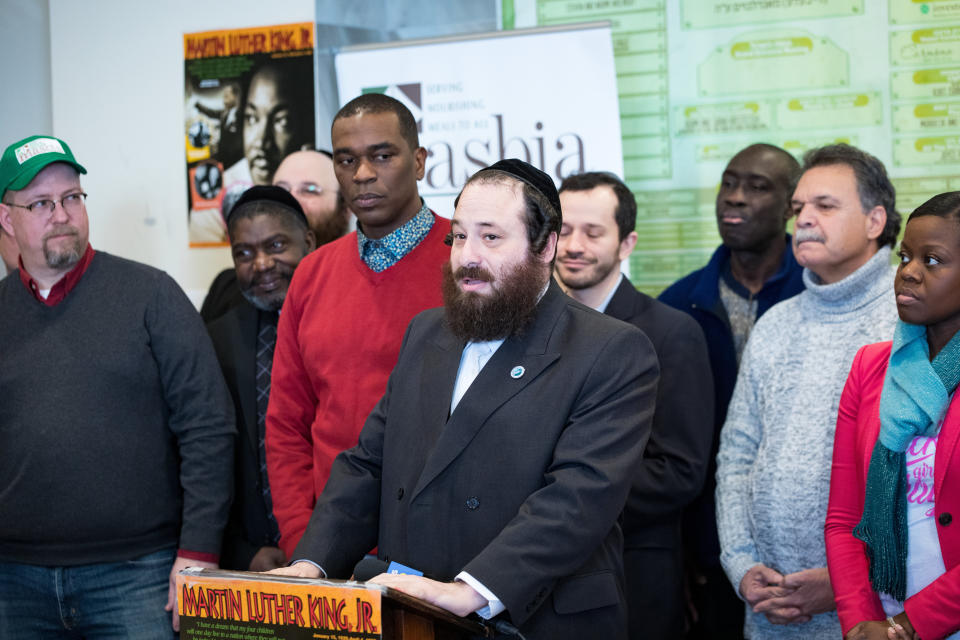 Rockland County legislator Aron Wieder, center, speaks at a Martin Luther King Day event in Brooklyn's Borough Park neighborhood. The event showcased Black-Jewish solidarity. (Photo: Benjamin Kanter)