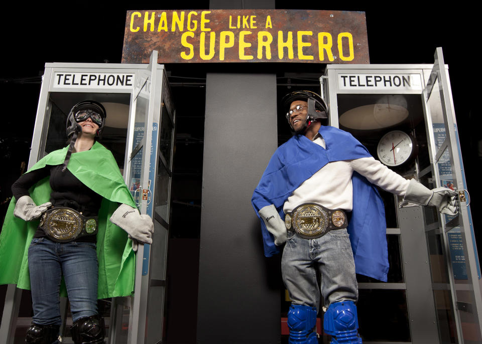 In this Feb. 17, 2012 photo provided by the Museum of Science and Industry, friends and relatives come out of phone booths during setup for the "Change Like A Superhero" station of the "MythBusters: The Explosive Exhibition" exhibit modeled after Discovery Channel television show "Mythbusters" at the Museum of Science and Industry in Chicago. The exhibit opens Thursday, March 15 and runs through Sept. 3. The planned national tour that will include stops at several other U.S. cities. (AP Photo/Museum of Science and Industry, J.B. Spector)