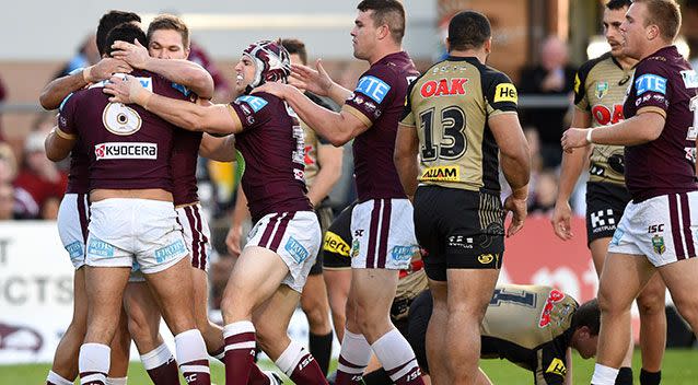 Dylan Walker (left) of the Sea Eagles is congratulated after scoring a try. Source: AAP Image/Paul Miller