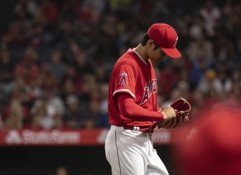 Shohei Ohtani has a blister on his pitching hand, and a change in baseball lacing yarn could be why. (AP Photo/Kyusung Gong)