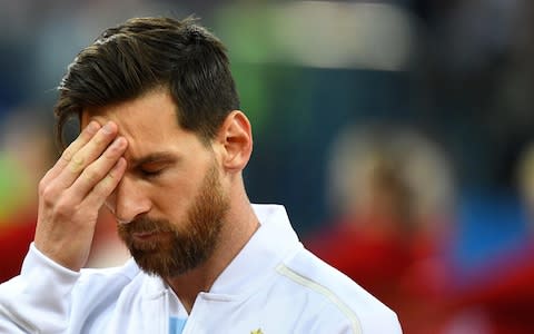 Lionel Messi touches his forehead before the Russia 2018 World Cup Group D football match between Argentina and Croatia - Credit: JOHANNES EISELE/AFP