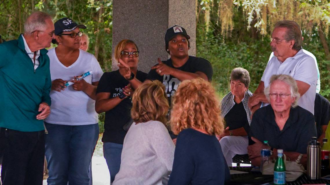 ‘community conversation’ with Mayor Alan Perry and councilman Alex Brown on May 19, 2023 with her cousins Charise Graves, second from left and Tijuana Wright-Mcleod at Squire Pope Community Park on Hilton Head Island. The women are granddaughters of Josephine Wright, 93 a landowner who is being sued by developer Bailey Point for property encroachment.