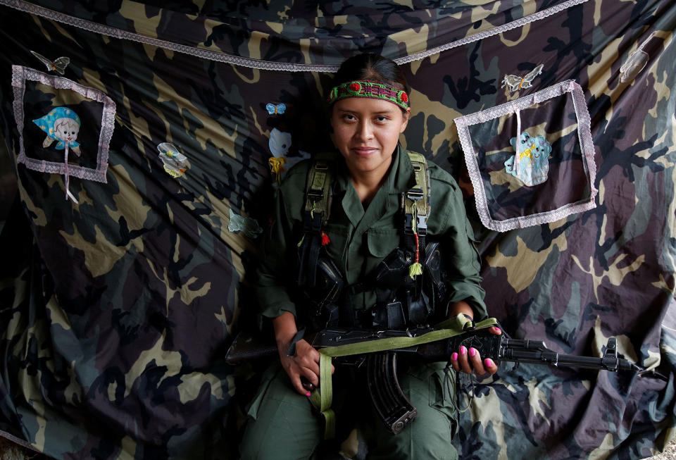<p>Leidi, a member of the 51st Front of the Revolutionary Armed Forces of Colombia (FARC), poses for a picture at a camp in Cordillera Oriental, Colombia, August 16, 2016. (John Vizcaino/Reuters) </p>