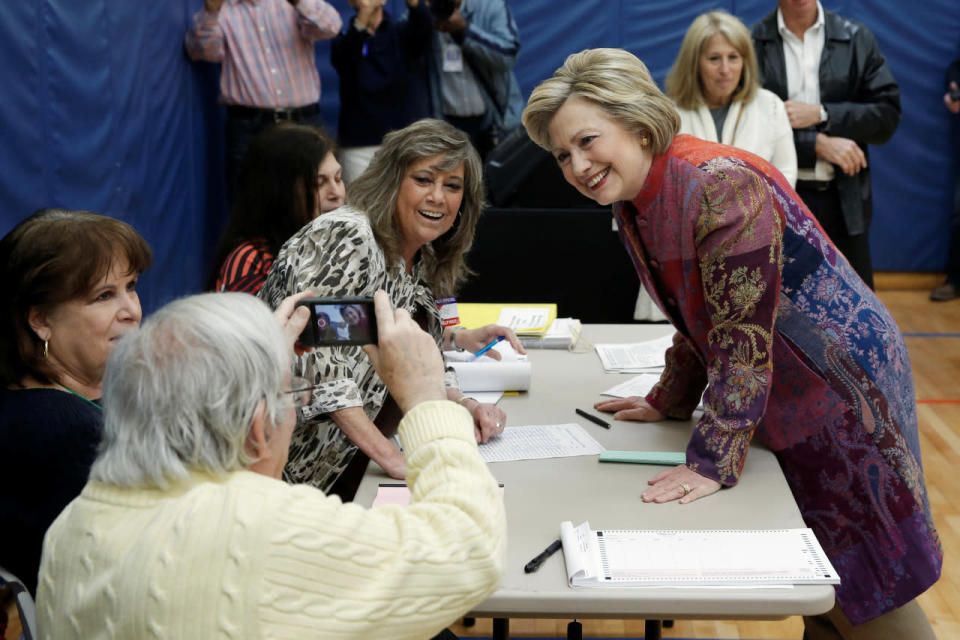 Hillary poses for a photograph before voting