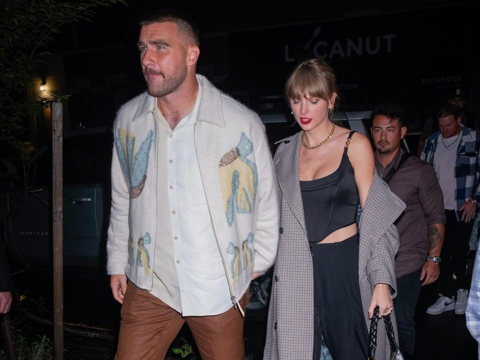 Travis Kelce and Taylor Swift leave "Saturday Night Live" in New York City.