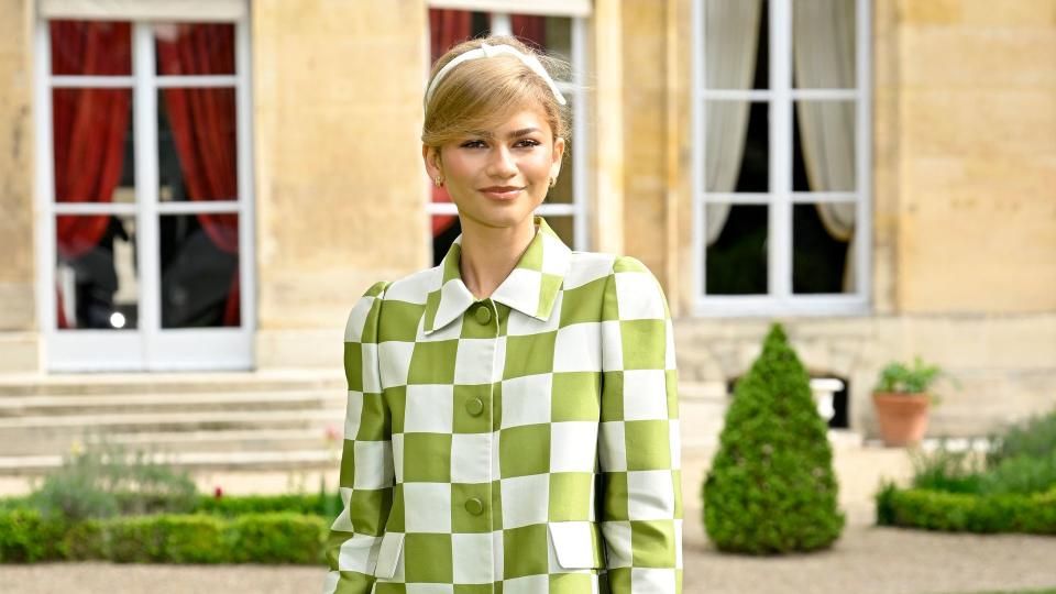 Zendaya attends the "Challengers" Paris Photocall at Maison De L'Amerique Latine in a chequered green and white mini dress 