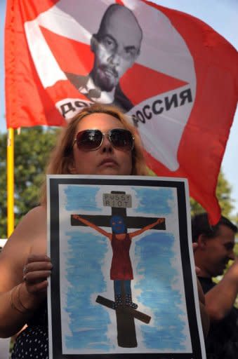 Russian opposition activists protest against the detention of members of the all-female punk band Pussy Riot in St.Petersburg on July 26, 2012. Initial hearings in the trial earlier this month saw the court order the three members of the rock group stay in detention until January 2013, a move their supporters condemned as a travesty of justice