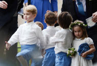 <p>Princess Charlotte held onto her bouquet of flowers and followed her brother as he pretended to be a soldier outside the church. Photo: Australscope </p>