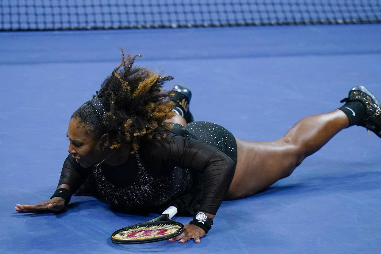 Serena Williams, of the United States, falls to the court during a match against Ajla Tomljanovic, of Austrailia, during the third round of the U.S. Open tennis championships, Friday, Sept. 2, 2022, in New York. (AP Photo/Frank Franklin II)