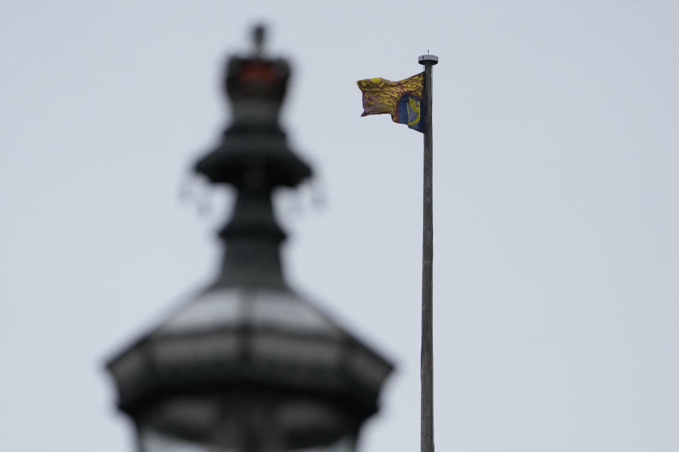 The Royal Standard flies above the round tower at Windsor castle, England on Christmas Day, Saturday, Dec. 25, 2021. Britain's Queen Elizabeth II has stayed at Windsor Castle instead of spending Christmas at her Sandringham estate due to the ongoing COVID-19 pandemic. (AP Photo/Alastair Grant)