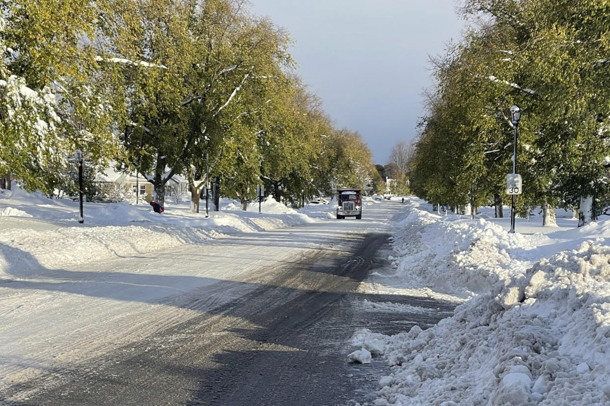 Snow covers the ground in Buffalo, N.Y. on Saturday, Nov. 19, 2022. Residents of northern New York state are digging out from a dangerous lake-effect snowstorm that had dropped nearly 6 feet of snow in some areas and caused three deaths. The Buffalo metro area was hit hard, with some areas south of the city receiving more than 5 feet by early Saturday. (AP Photo/Carolyn Thompson)