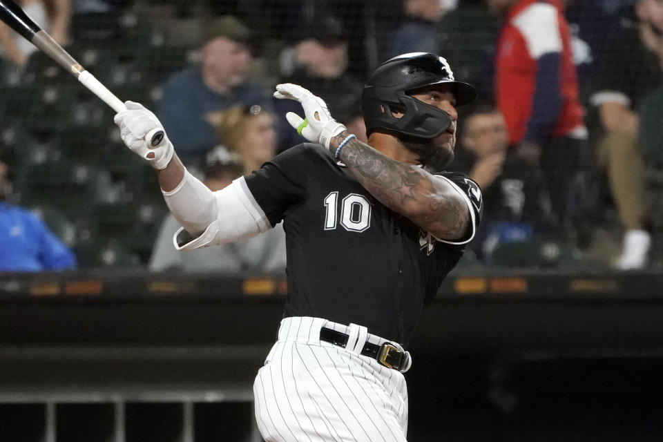 Chicago White Sox's Yoan Moncada hits an RBI double off Minnesota Twins starting pitcher Josh Winder during the third inning of a baseball game Tuesday, Oct. 4, 2022, in Chicago. (AP Photo/Charles Rex Arbogast)