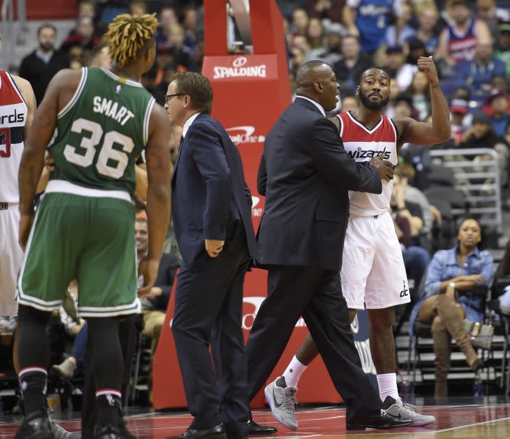 John Wall and Marcus Smart exchange words after Wall's Flagrant Foul 2. (AP)