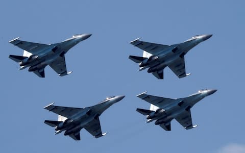 The Trump administration imposed sanctions on the Chinese military for buying Russian missile systems and jets, including the Su-35 combat aircraft pictured here - Credit: Sergei Karpukhin/Reuters