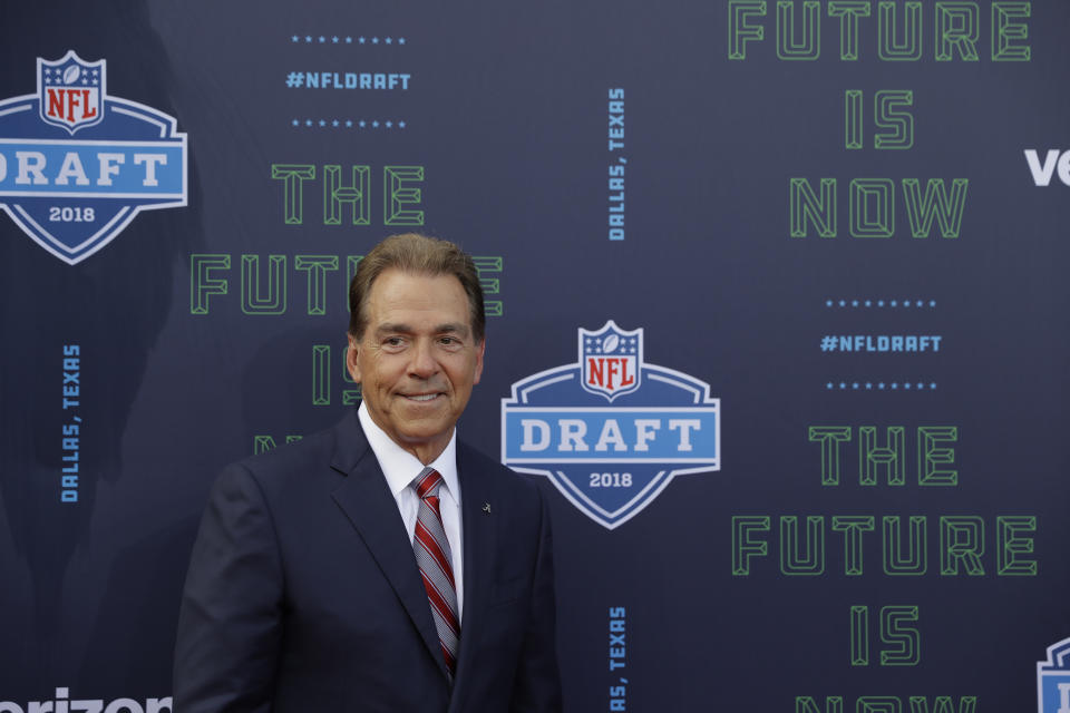 Alabama head coach Nick Saban poses for photos on the red carpet before the first round of the NFL football draft, Thursday, April 26, 2018, in Arlington, Texas. (AP Photo/Eric Gay)