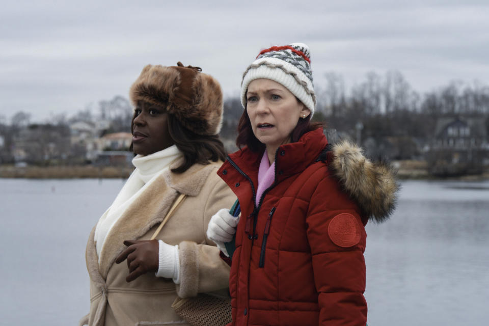 This image released by CBS shows Retta, left, Carrie Preston in a scene from "Elsbeth." (Christopher Saunders/CBS via AP)