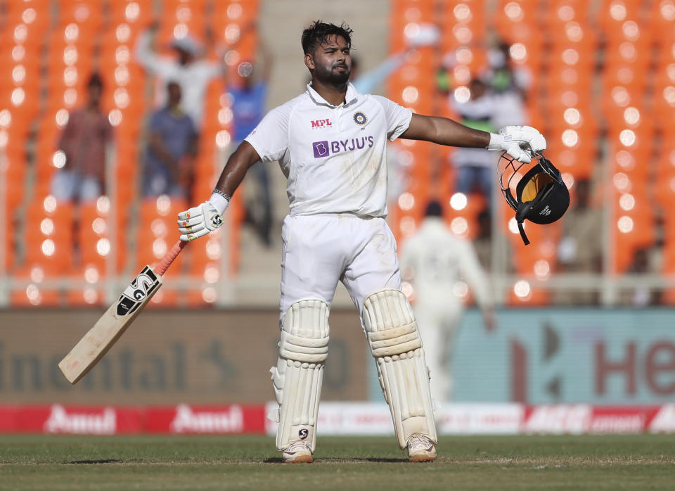 India's Rishabh Pant celebrates scoring a century during the second day of fourth cricket test match between India and England at Narendra Modi Stadium in Ahmedabad, India, Friday, March 5, 2021. (AP Photo/Aijaz Rahi)