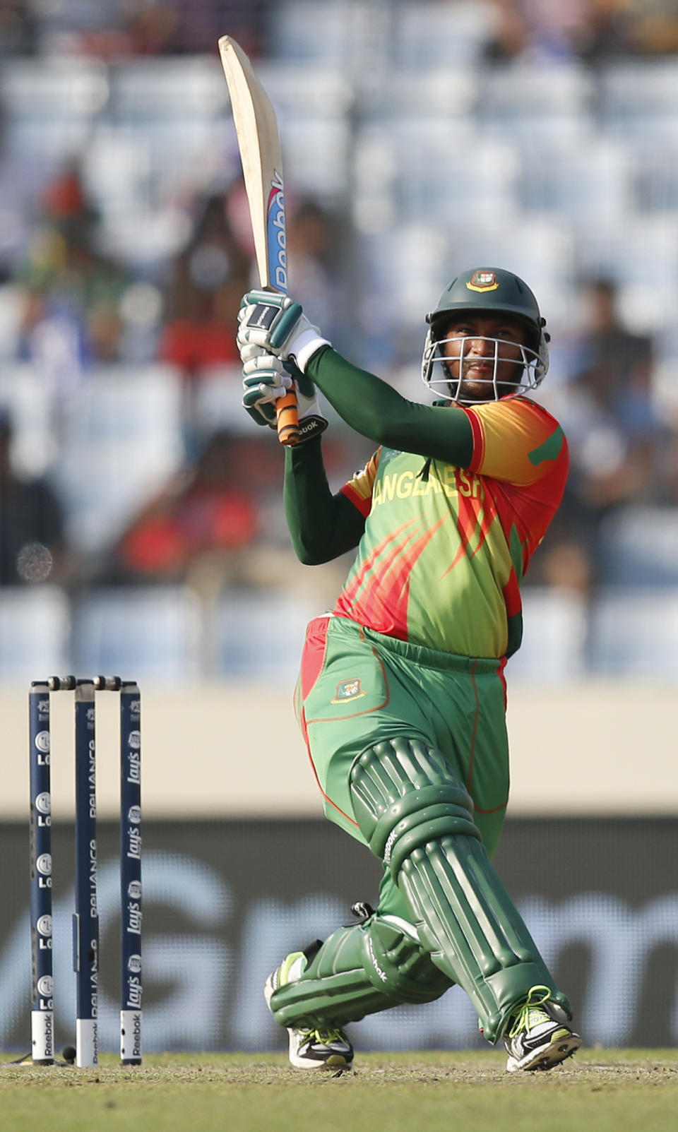 Bangladeshi batsman Shakib Al Hasan plays a shot during their ICC Twenty20 Cricket World Cup match against Australia in Dhaka, Bangladesh, Tuesday, April 1, 2014. (AP Photo/Aijaz Rahi)