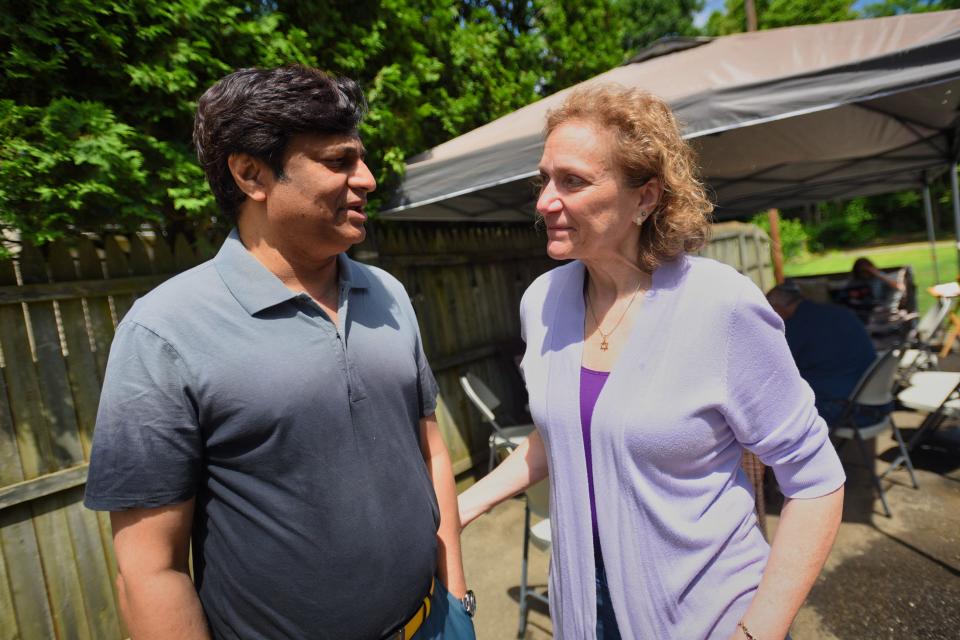 Khaja Khateeb talks with Joan Goldstein during the Interfaith Encounter Association's brunch in Pompton Lakes on May 29.