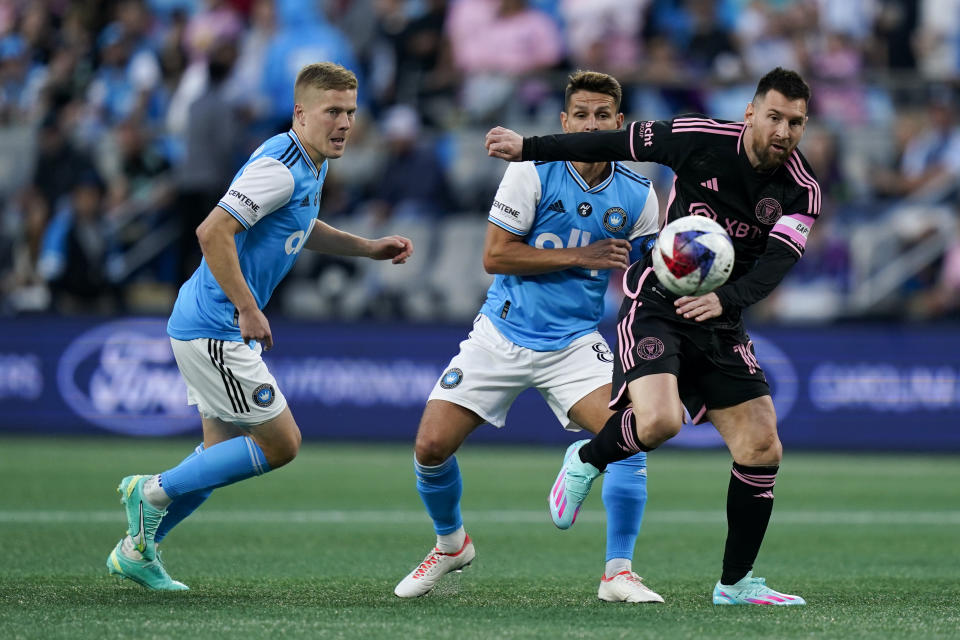 Inter Miami forward Lionel Messi, right, chases the ball during the first half of an MLS soccer match against Charlotte FC, Saturday, Oct. 21, 2023, in Charlotte, N.C. (AP Photo/Erik Verduzco)