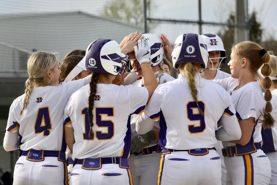 Aislynn Palmer, who pitched and hit her way to the win, is congratulated at home plate after one of her two home runs during Hononegah's 10-5 in over Belvidere North on Monday, April 22, 2024, in Roscoe.