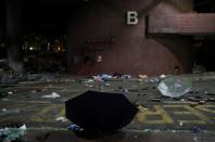 A view of two open umbrellas among rubble at the Hong Kong Polytechnic University (PolyU), in Hong Kong, China