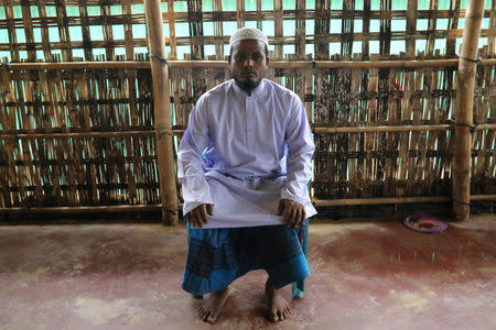 Abdul Zalil, an Islamic teacher in the Kutupalang refugee camp, poses at his Islamic school in Cox's Bazar, Bangladesh, June 25, 2018. REUTERS/Mohammad Ponir Hossain