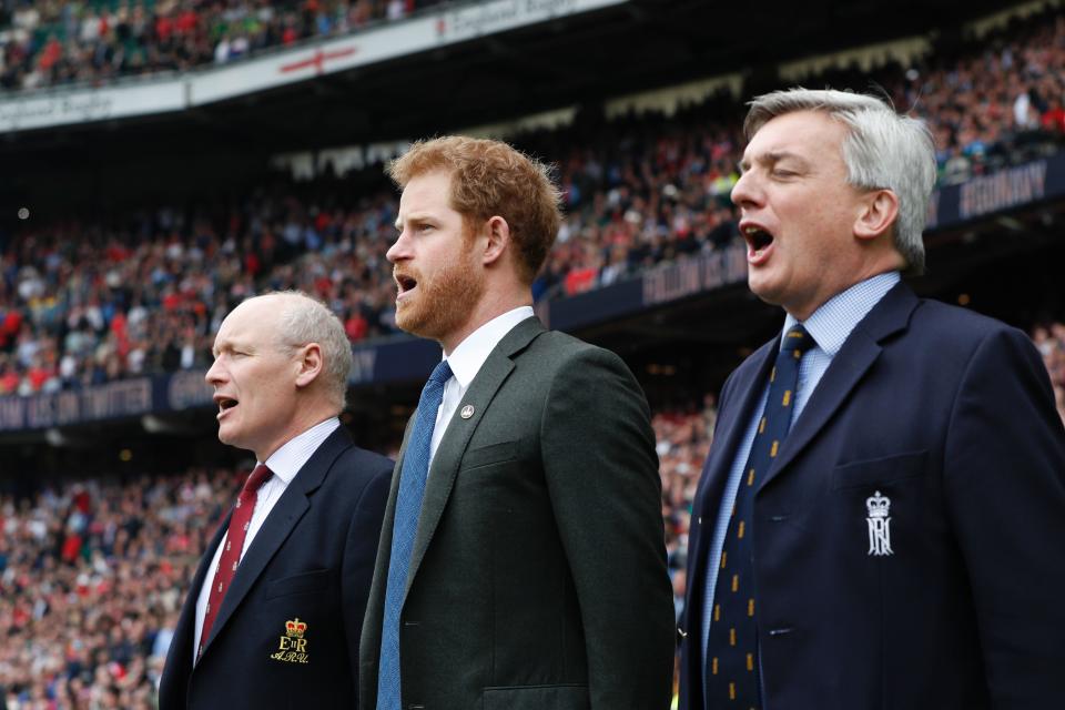 Britain's Prince Harry (C) sings the national anthem ahead of the annual Army Navy armed forces rugby match at Twickenham, west London, on April 29, 2017.
Prince Harry attended the Army Navy match at Twickenham as Patron of the Invictus Games Foundation, which is the Official Charity of the day for this years match. The Army Navy Match is the annual rugby union match between the senior XV teams of the Royal Navy and British Army. This year sees the 100th fixture. / AFP PHOTO / POOL / Adrian DENNIS        (Photo credit should read ADRIAN DENNIS/AFP via Getty Images)