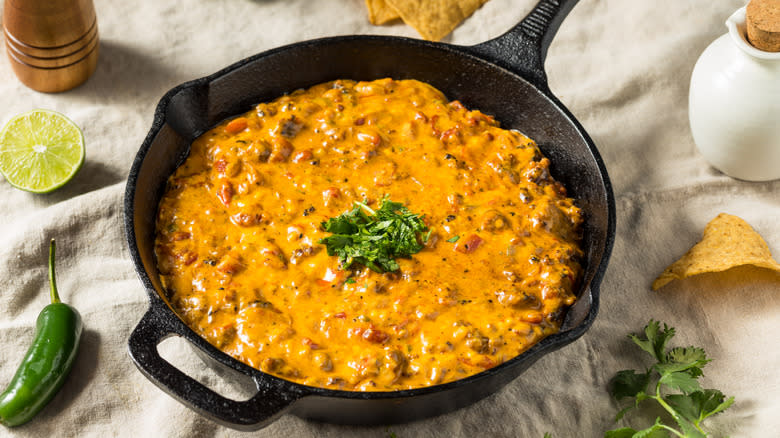 Smoked queso dip in cast iron skillet