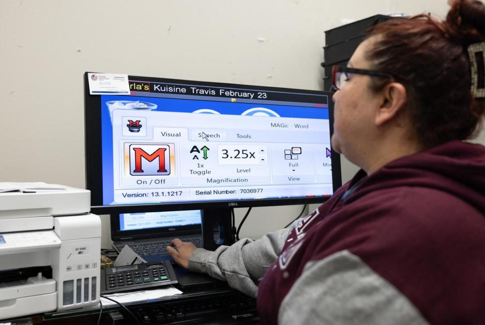 Karla Martinez uses a trackpad to navigate around an enlarged screen on Jan. 18, 2024. One software that Martinez uses to enlarge text on the computer is a software called MAGic.