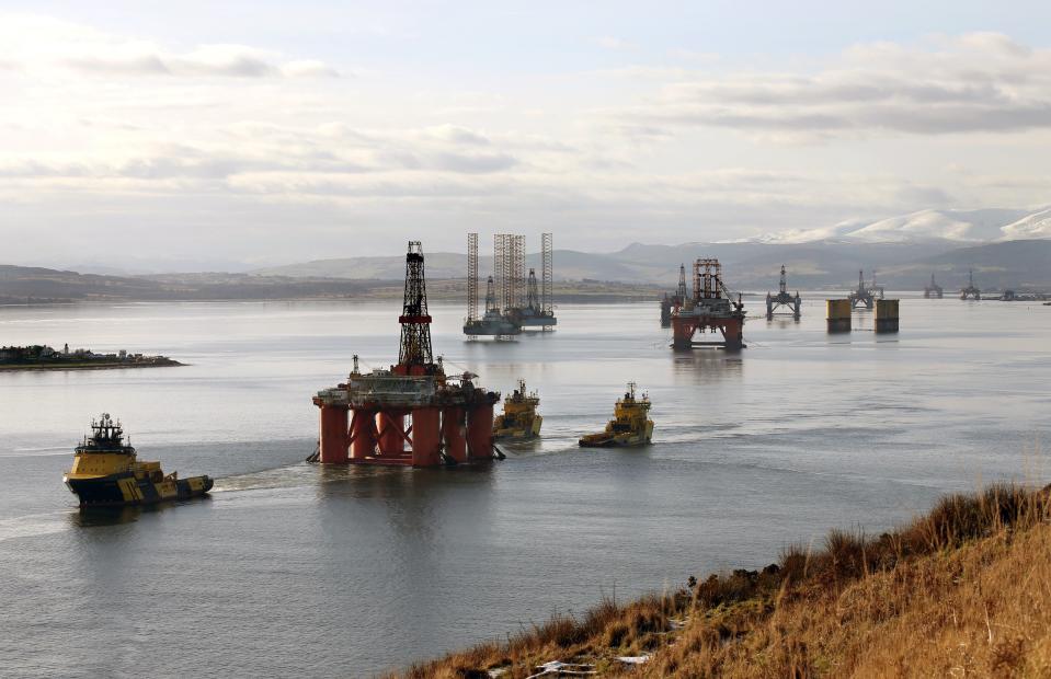 <p>Oil rigs in the Cromarty Firth</p> (PA Archive)