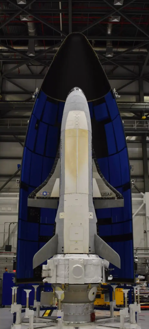 The X-37B orbital test vehicle ahead of its sixth mission, with the service module attached to its rear portion. <em>U.S. Space Force</em>