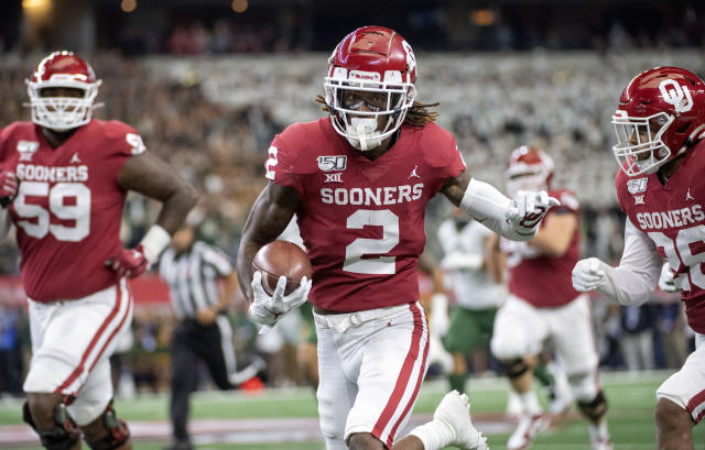 Oklahoma defensive tackle Jalen Redmond (31), defensive lineman Neville  Gallimore (90) and linebacker Nik Bonitto (35) celebrate Redmond's sack of  Baylor quarterback Gerry Bohanon during the second half of an NCAA college