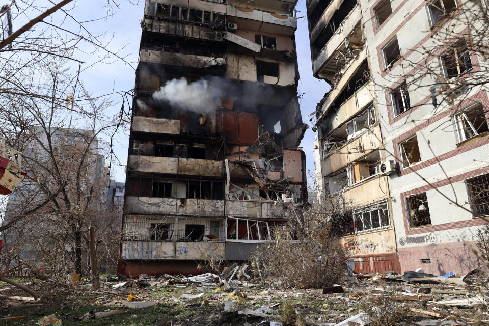 A residential multi-story building is seen damaged after a Russian missile hit it in southeastern city of Zaporizhzhia, Ukraine, Wednesday, March 22, 2023. (AP Photo/Kateryna Klochko)